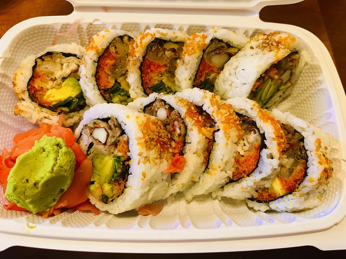 Sushi rolls with avocado, ginger, and wasabi